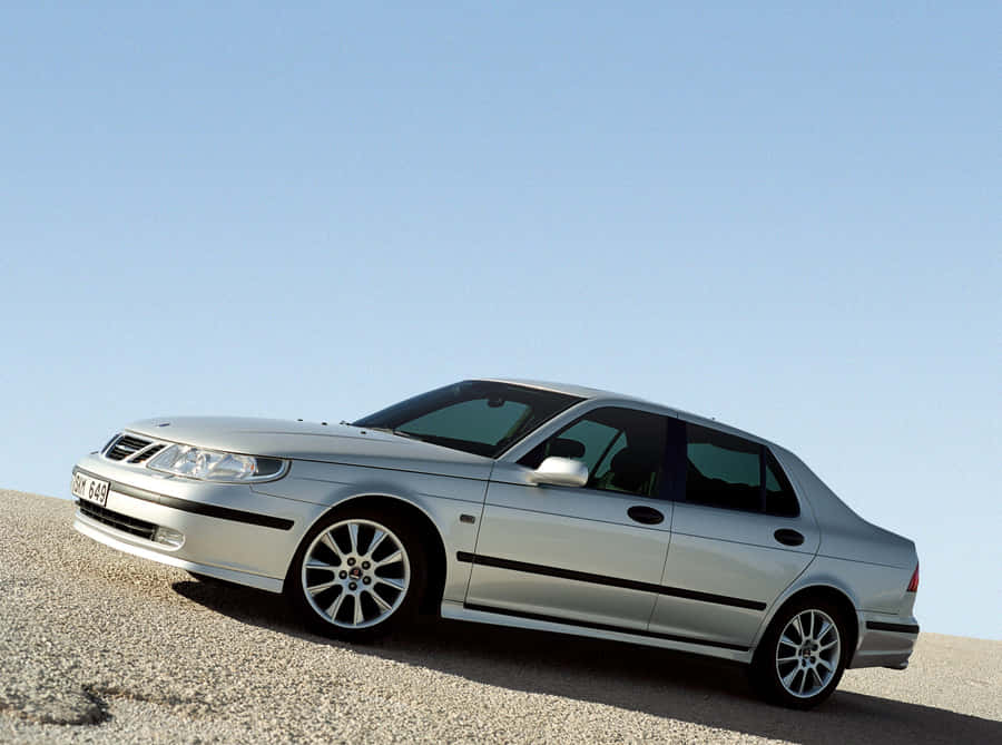 Caption: Elegant Saab 9-5 In Motion Wallpaper