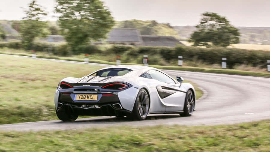 Caption: Evoking Power And Elegance - The Mclaren 540c Wallpaper