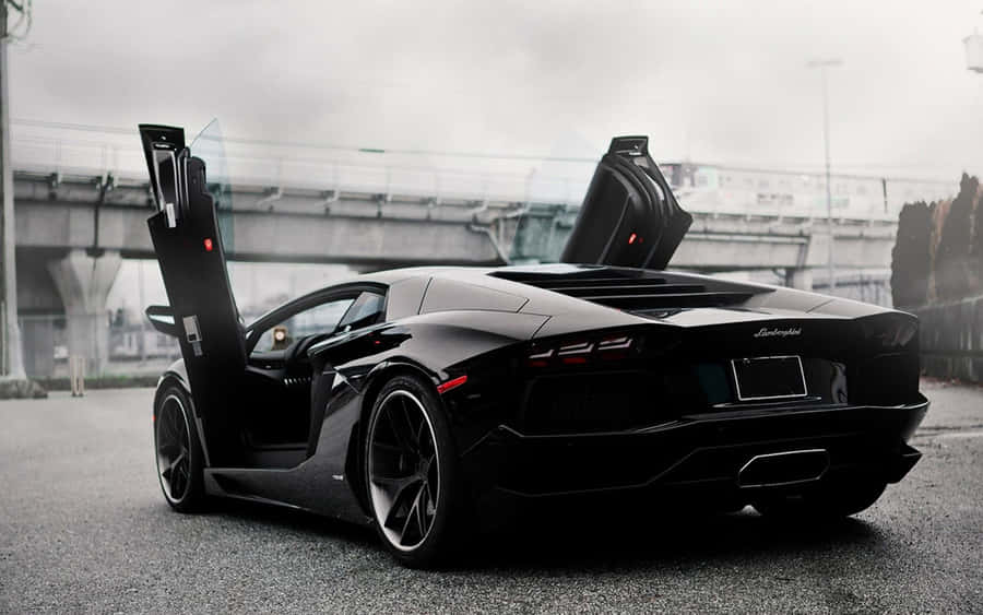 Caption: High Speed Adrenaline - Sports Car In Action Wallpaper