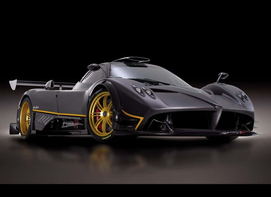 Caption: Impressively Sleek, Pagani Huayra Super Luxury Sports Car On An Empty Road. Wallpaper