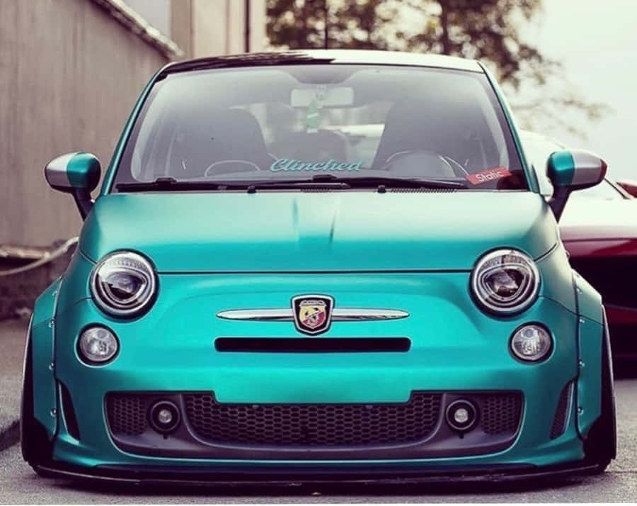 Caption: Luxurious Abarth 695 Tributo Ferrari Poised For Action Wallpaper