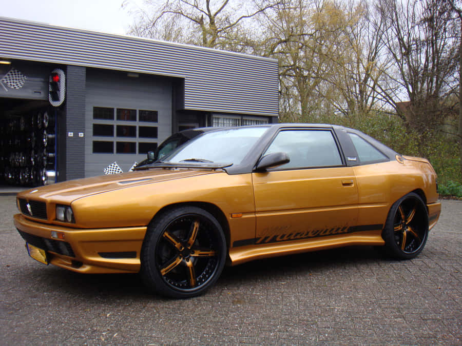 Caption: Luxury Exemplified - Maserati Shamal In Stunning Black Wallpaper