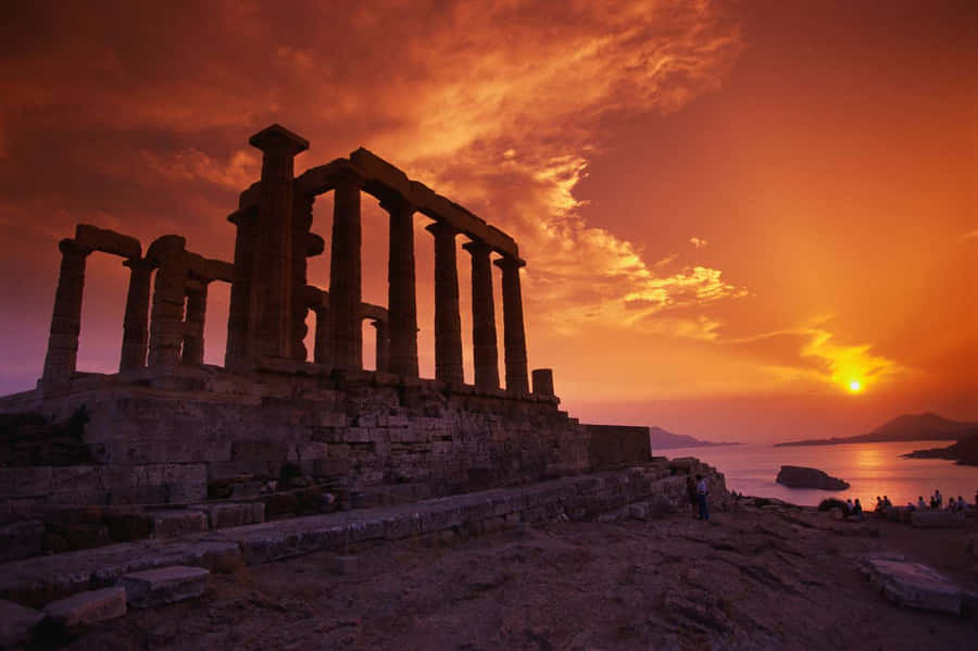 Caption: Magnificent Sunset Over Poseidon's Temple In Sounion Wallpaper