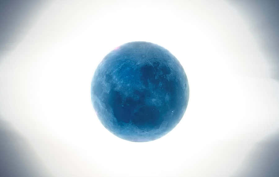 Caption: Majestic Perigee Moon Rising Above The Horizon Wallpaper