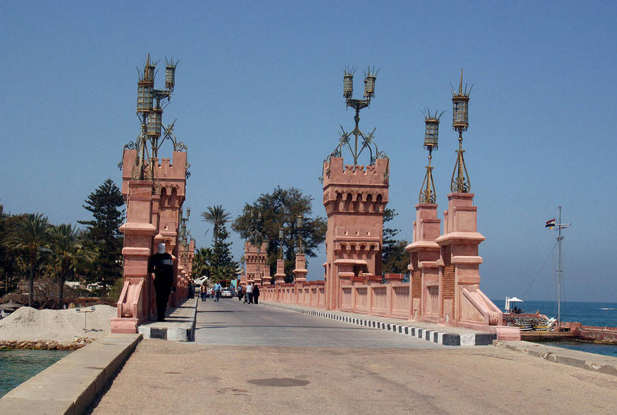Caption: Majestic View Of Alexandria's El Montaza Bridge At Sunset Wallpaper