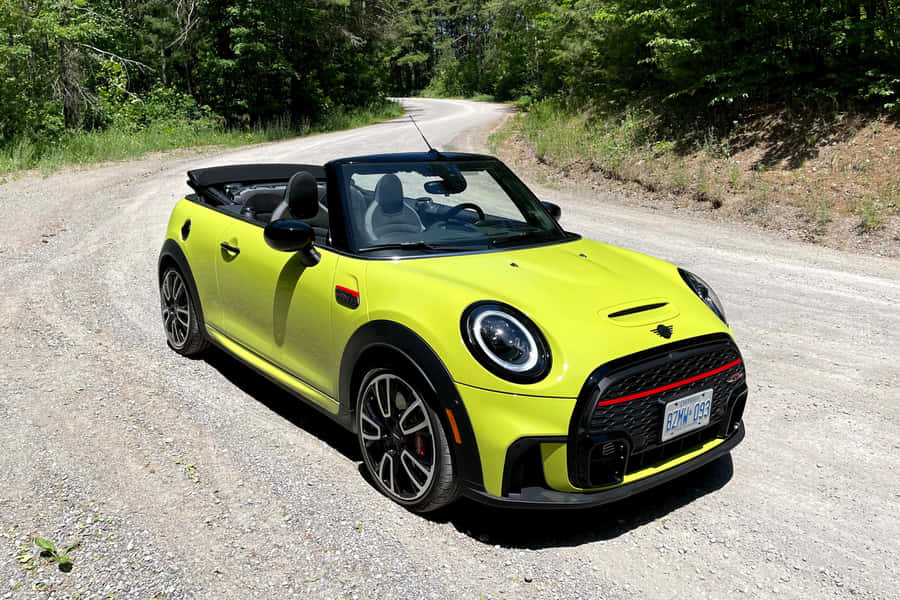 Caption: Mini Cooper Convertible Cruising In Style Wallpaper
