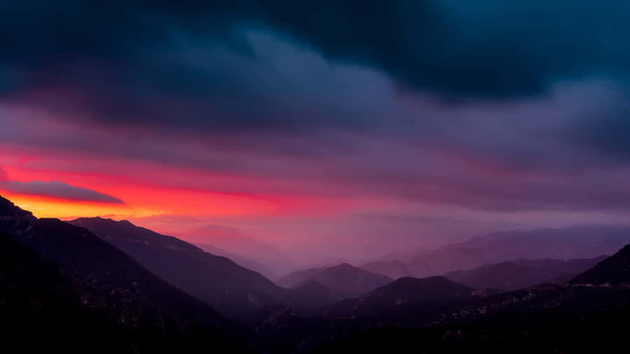 Caption: Mysterious Dark Mountain Under The Night Sky Wallpaper