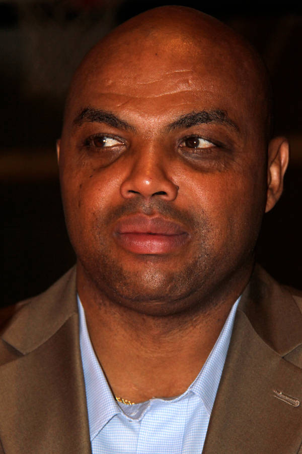 Caption: Nba Legend Charles Barkley Showing His Poker Face Wallpaper