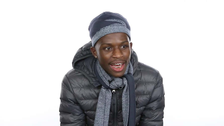 Caption: Quando Rondo Performing Live On Stage Wallpaper