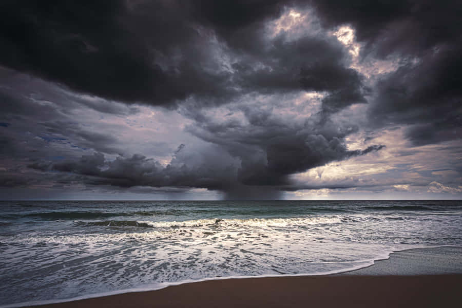 Caption: Refreshing Sea Breeze On A Sunny Day Wallpaper