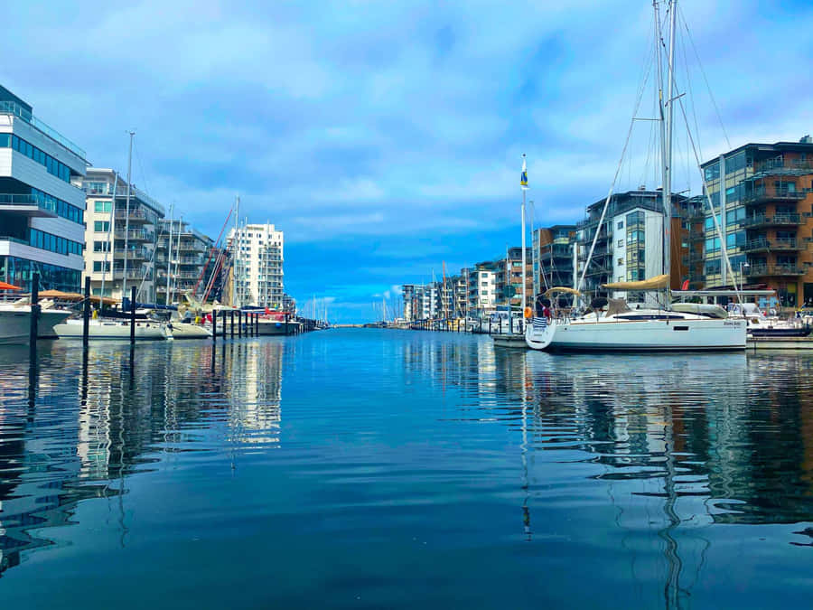 Caption: Scenic Panorama Of Malmö Skyline During Sunset Wallpaper