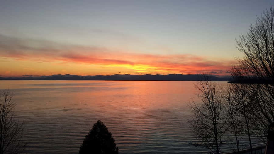 Caption: Serene Sunrise Over Lake Champlain, Burlington Wallpaper
