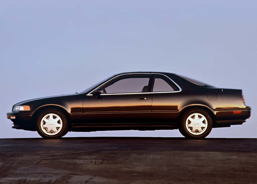 Caption: Sleek Acura Legend Cruising The Night Wallpaper