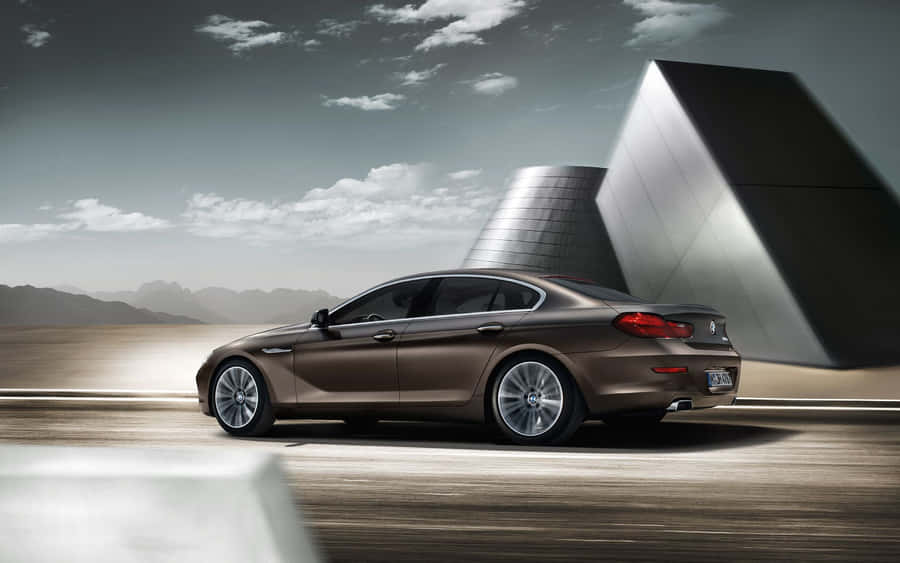 Caption: Sleek And Elegant Bmw 6 Series On The Road Wallpaper