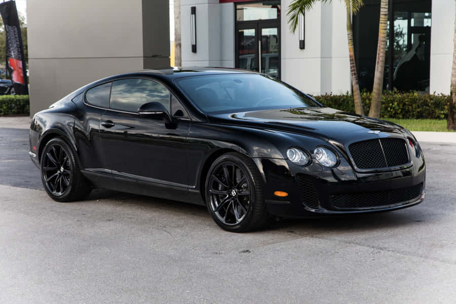 Caption: Sleek And Powerful Bentley Continental Supersports In Action Wallpaper