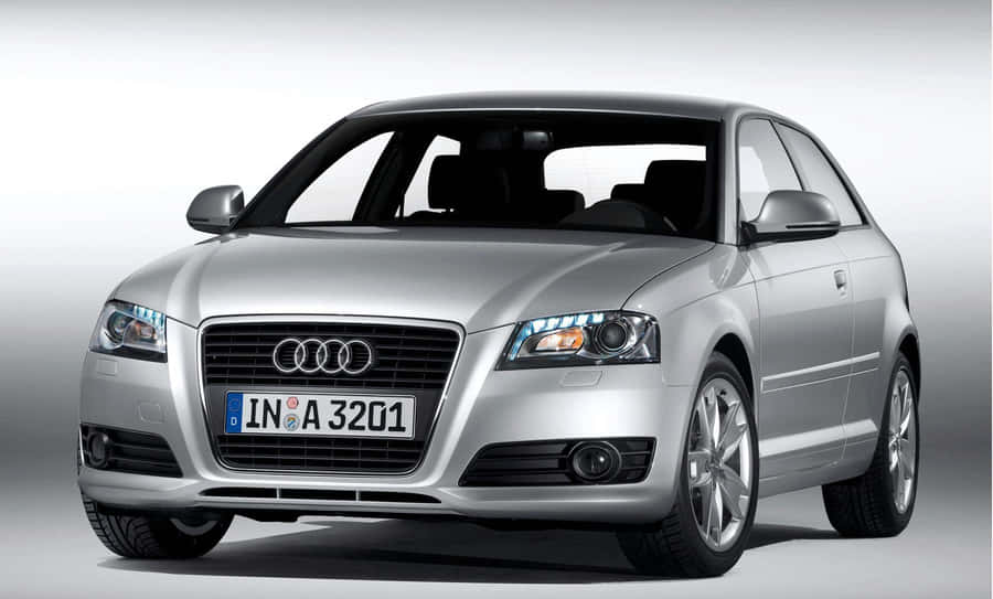 Caption: Sleek Audi S3 Sedan In Urban Landscape Wallpaper