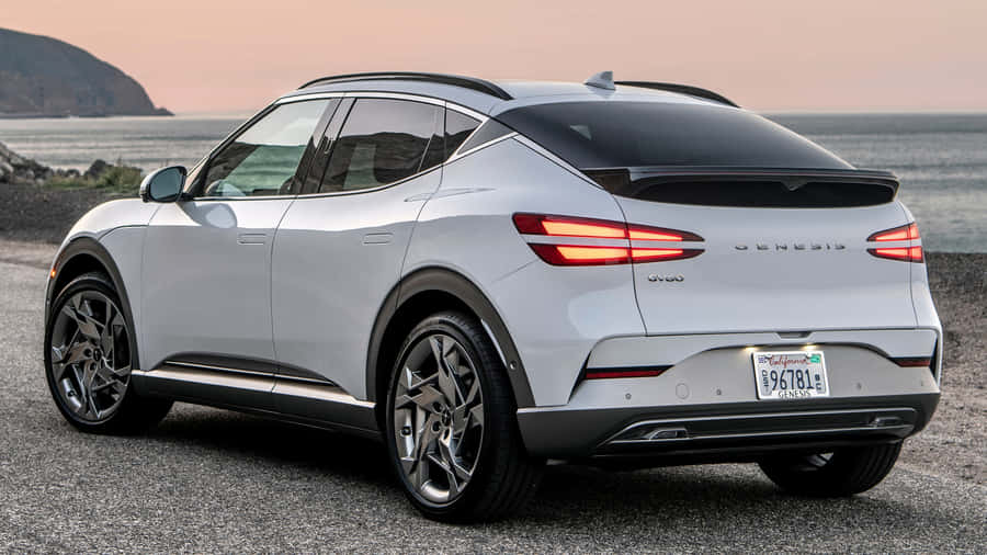 Caption: Sleek Genesis Gv60 On The Open Road Wallpaper