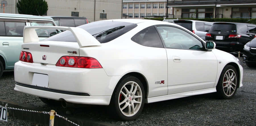 Caption: Sleek Honda Integra On The Road Wallpaper