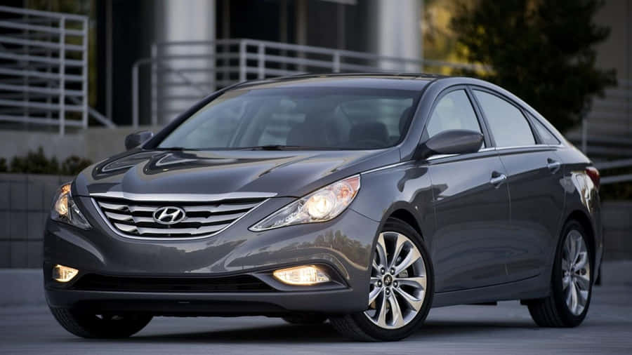 Caption: Sleek Hyundai Sonata On A Scenic Drive Wallpaper