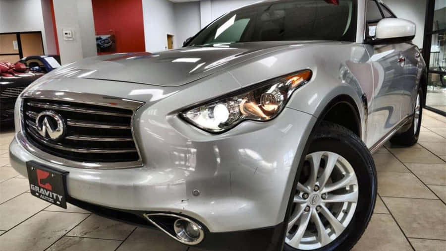 Caption: Sleek Infiniti Fx35 In An Open Road Wallpaper
