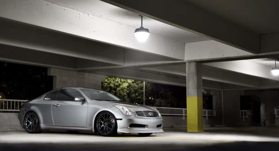 Caption: Sleek Infiniti G35 Sports Sedan In A Striking Urban Setting Wallpaper