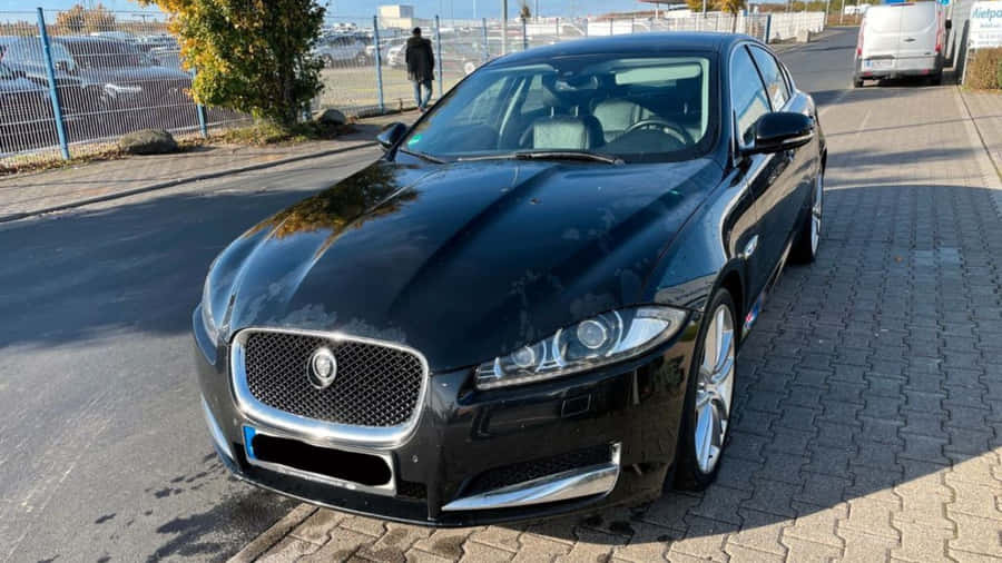 Caption: Sleek Jaguar Xf In Dynamic Drive Wallpaper