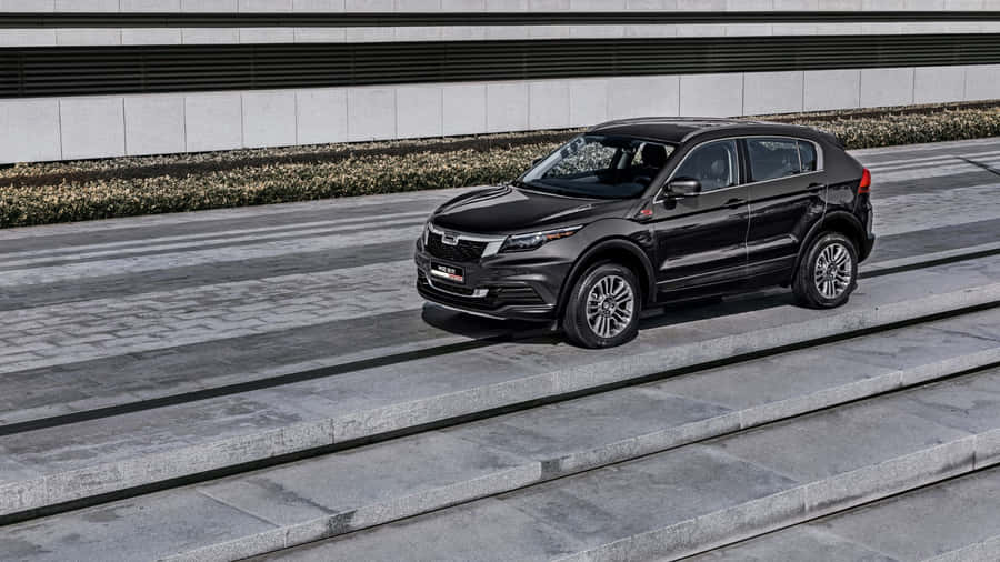 Caption: Sleek Qoros Sedan On An Open Road Wallpaper