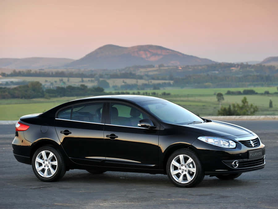 Caption: Sleek Renault Fluence On The Road Wallpaper