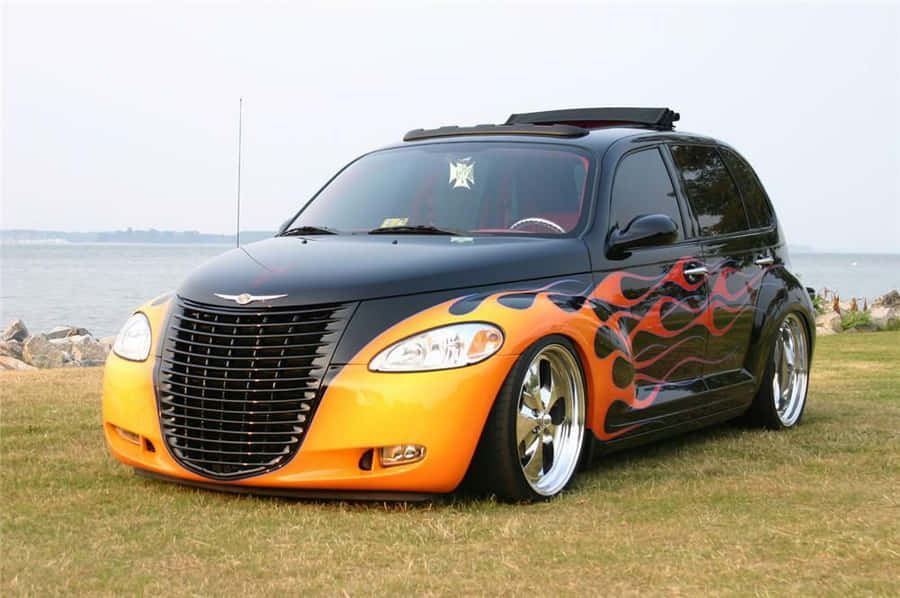 Caption: Sleek Silver Pt Cruiser On The Road Wallpaper