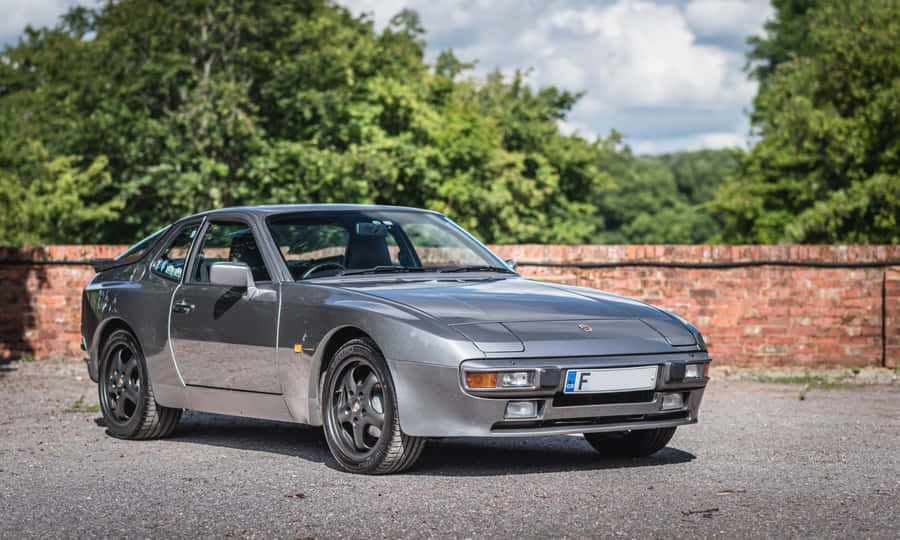 Caption: Sleek Vintage Porsche 944 In Maximum Drive Wallpaper