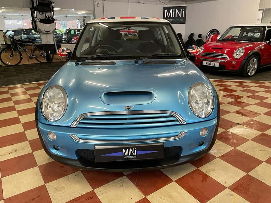 Caption: Sleek White Lifan 320 On Urban City Road Wallpaper