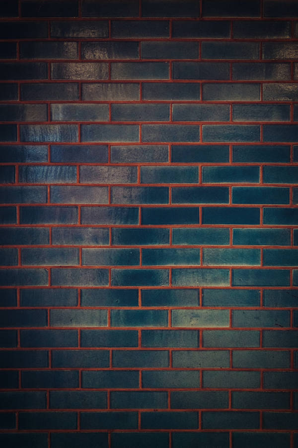 Caption: Striking Texture Of A Dark Brick Wall Wallpaper
