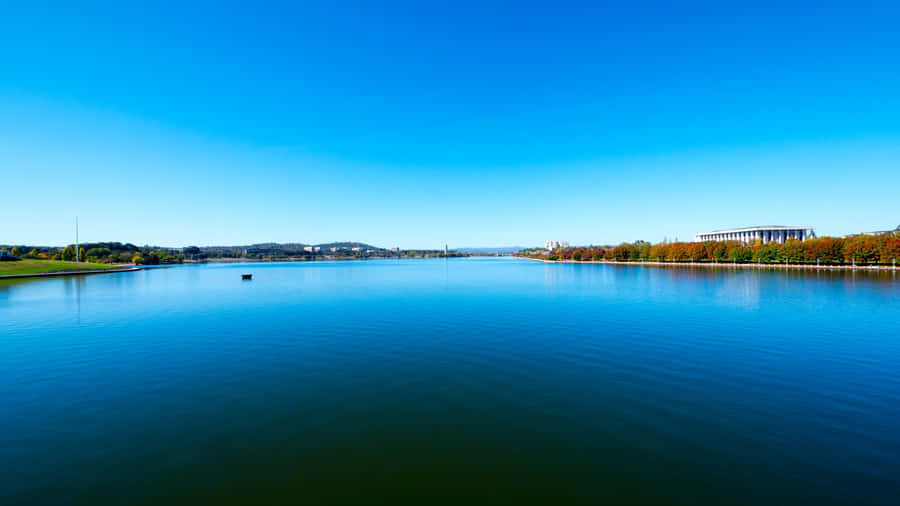 Caption: Stunning 4k View Of Serene River Landscape Wallpaper