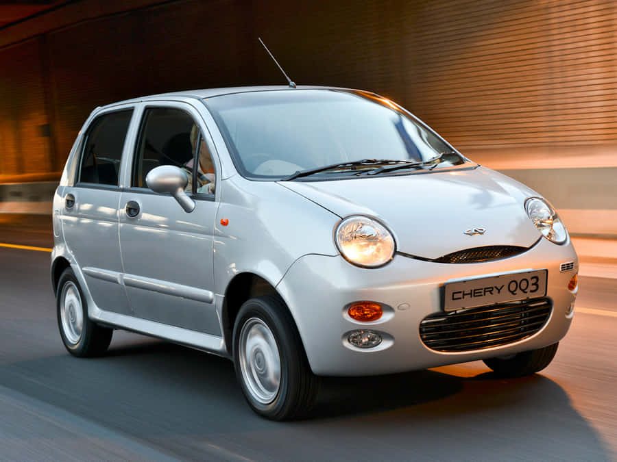 Caption: Stunning Chery Automobile In Action Wallpaper