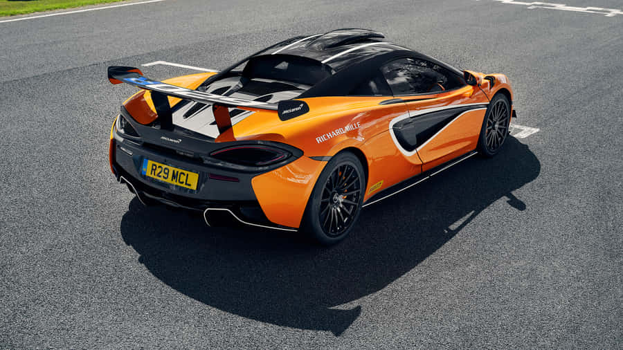 Caption: Stunning Mclaren 620r Dominating The Racetrack Wallpaper