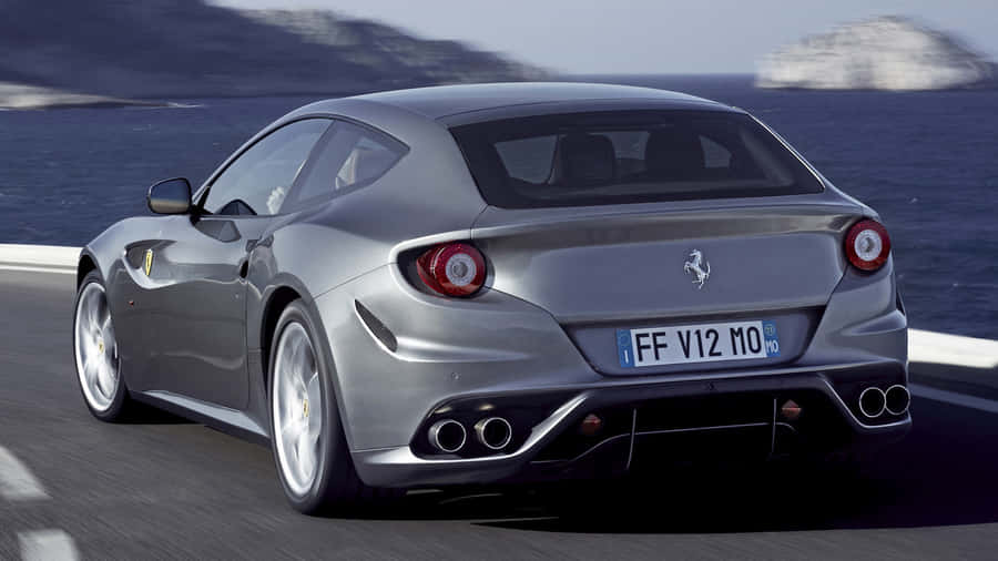 Caption: Stunning Red Ferrari Ff In Motion Wallpaper