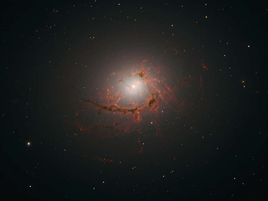 Caption: Stunning View Of A Dazzling Elliptical Galaxy Wallpaper