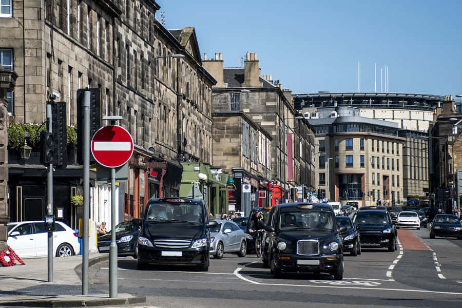 Caption: Stunning View Of Edinburgh Castle At Dusk Wallpaper