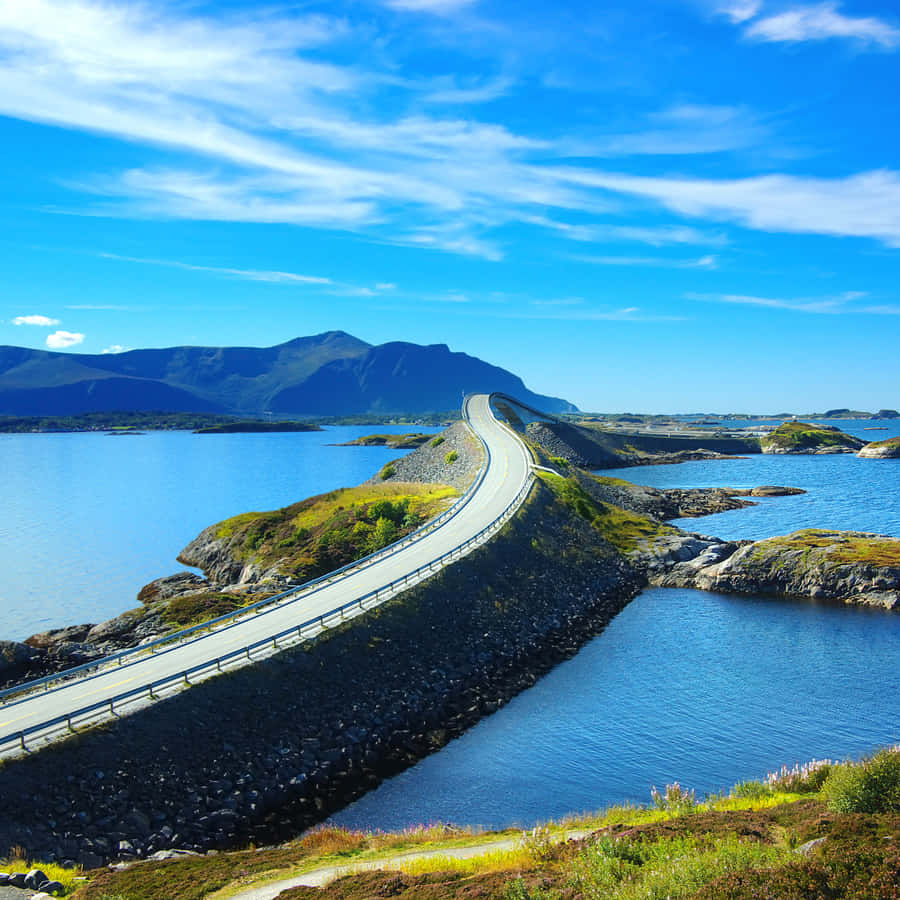 Caption: Stunning View Of The Storseisundet Bridge In Daylight Wallpaper