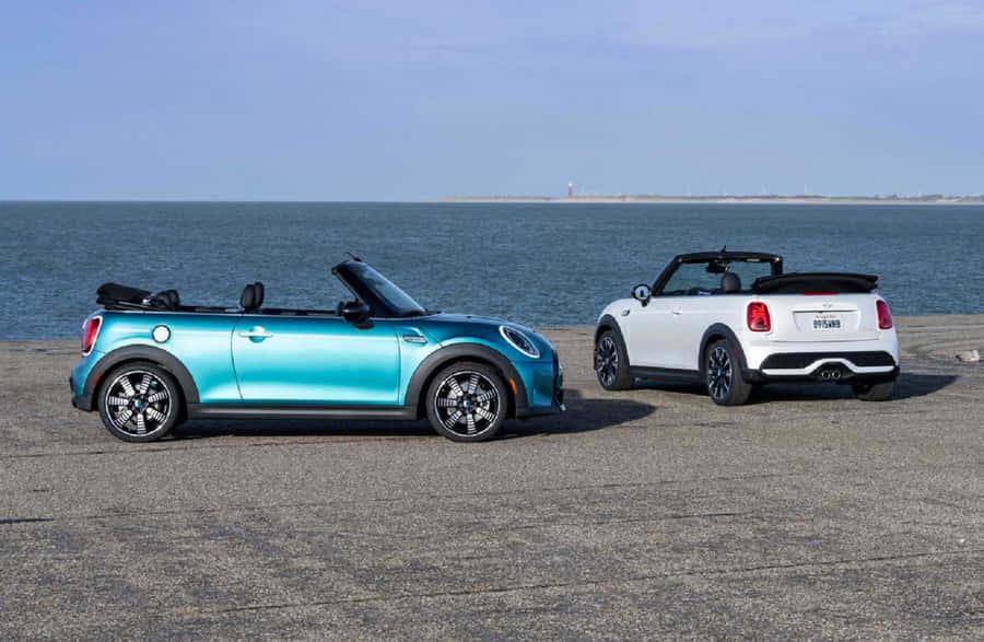 Caption: Stylish Mini Cooper Convertible Cruising Through The City Wallpaper