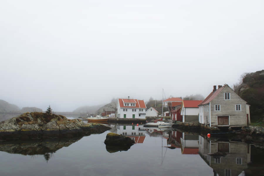 Caption: Sunset At Haugesund's Spectacular Coastline Wallpaper