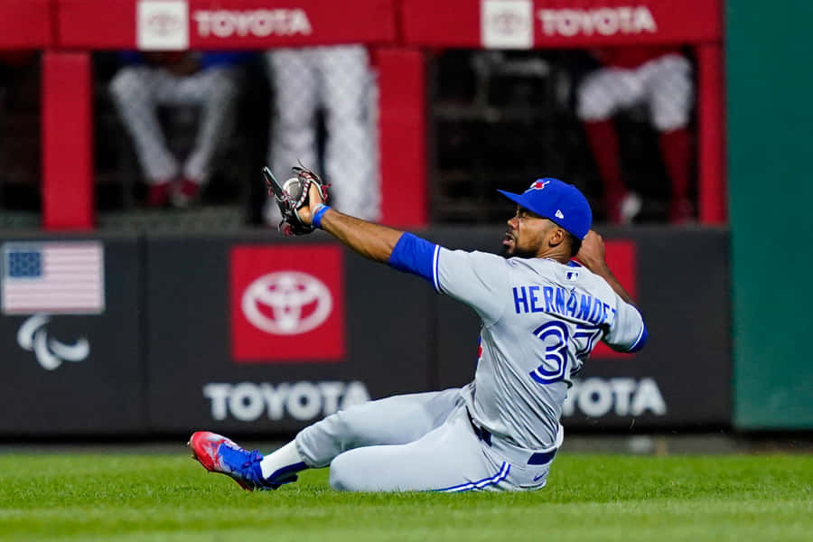 Caption: Teoscar Hernandez In Professional Baseball Action Wallpaper