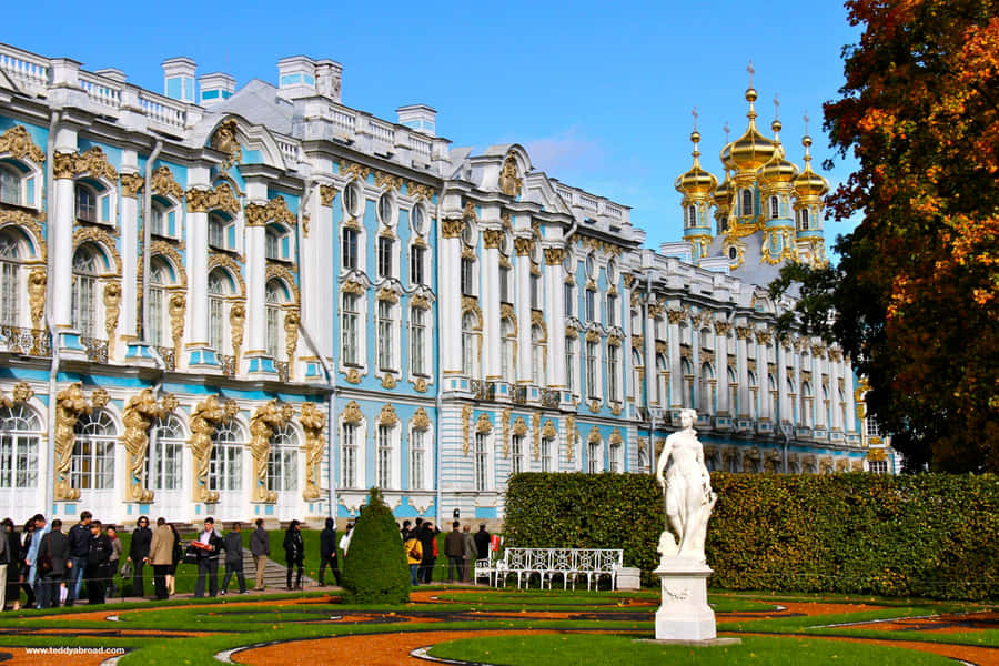 Caption: Tourists Queuing Outside The Majestic Catherine Palace In Russia Wallpaper