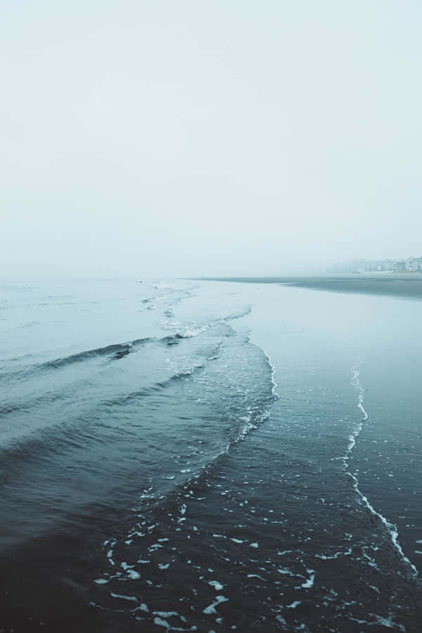 Caption: Tranquil Minimalist Beach Escape Wallpaper