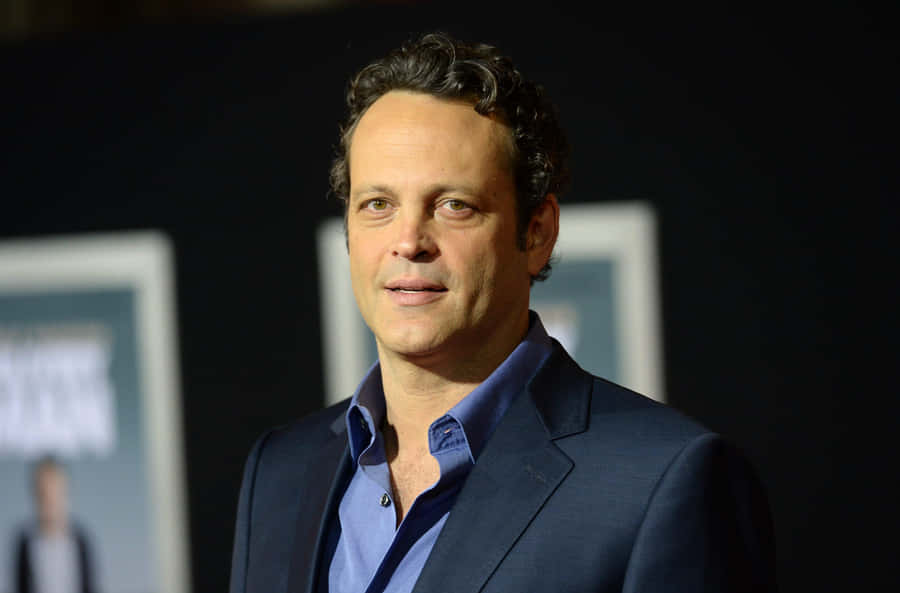 Caption: Vince Vaughn Smiling In A Classic Suit Wallpaper