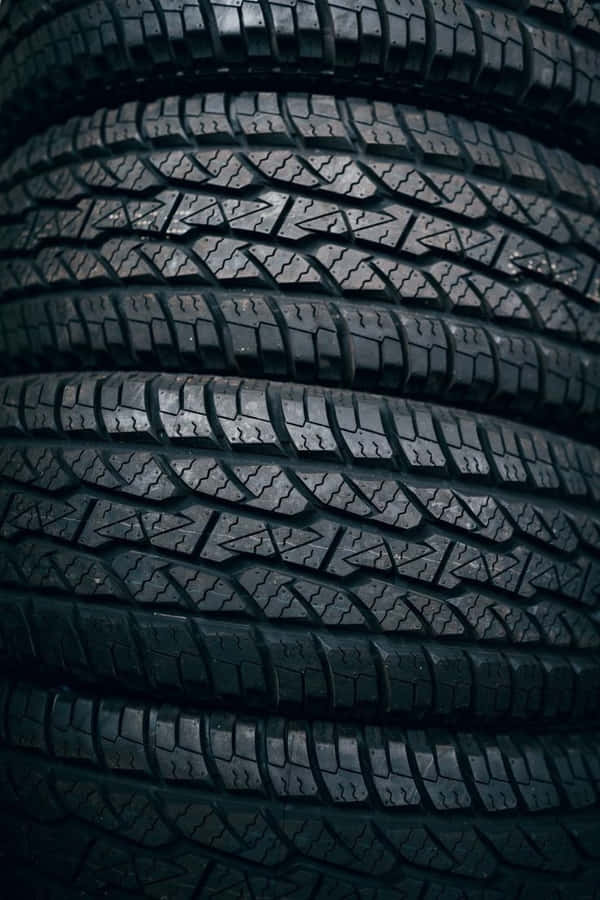 Caption: Winter Tires On Snowy Road Wallpaper
