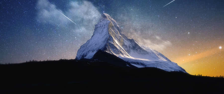 Captivating Mountain Range At Sunset Wallpaper