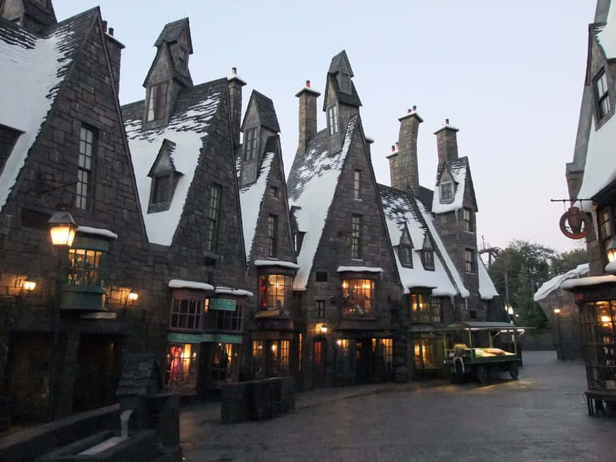 Captivating Scenery Of Hogsmeade Village During Winter Wallpaper