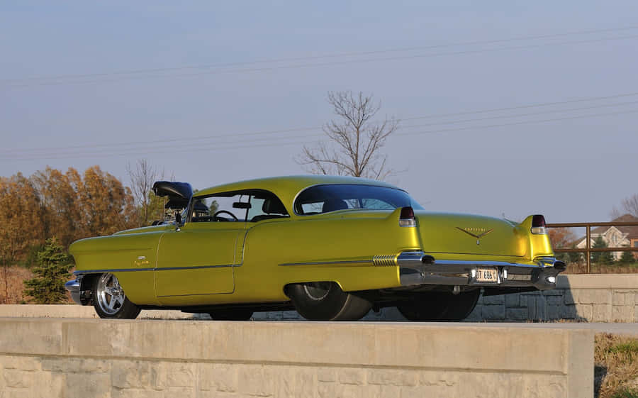 Captivating Silver Cadillac Deville In Premium Quality Wallpaper