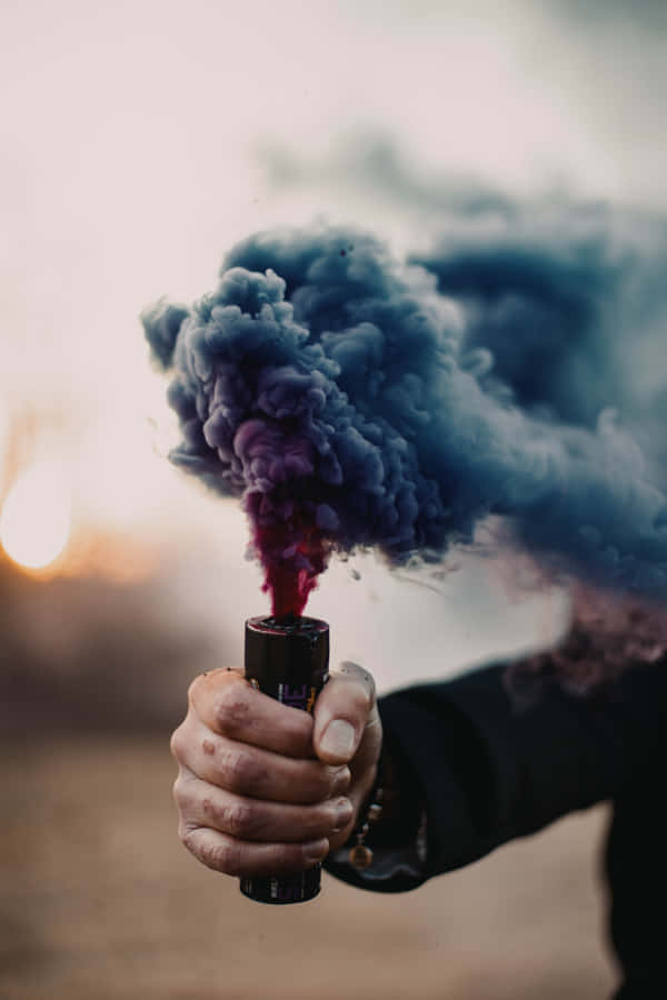 Captivating Smoke Twisted Alongside Vivid Colors. Wallpaper